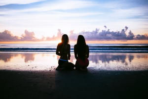 Mindfulness meditation - couple on beach